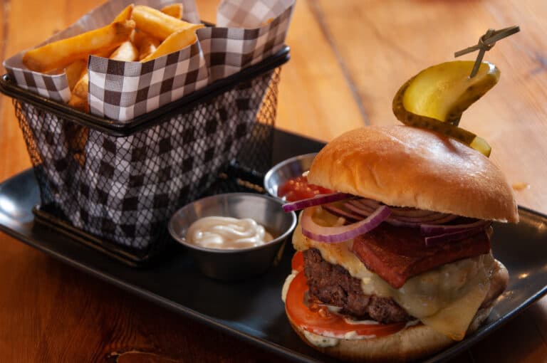 The 170 burger with chorizo and gherkin, served with fries.